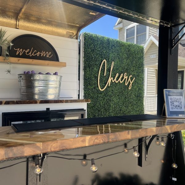 cheers photo backdrop on mobile bar